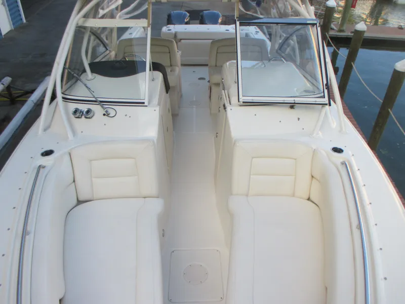 Slide: The Image of 2018 Grady-White Freedom 307 boat interior with spacious seating and dual consoles. - 33