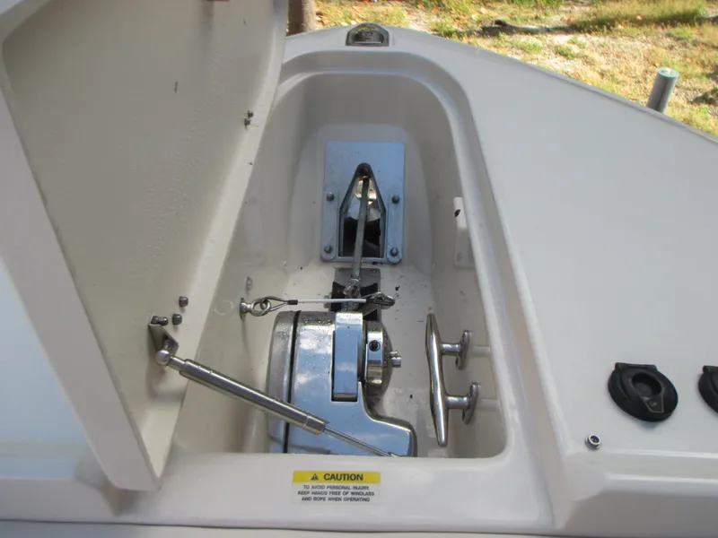 Slide: The Image of Anchor compartment of 2018 Grady-White Freedom 307 boat, open lid view. - 34