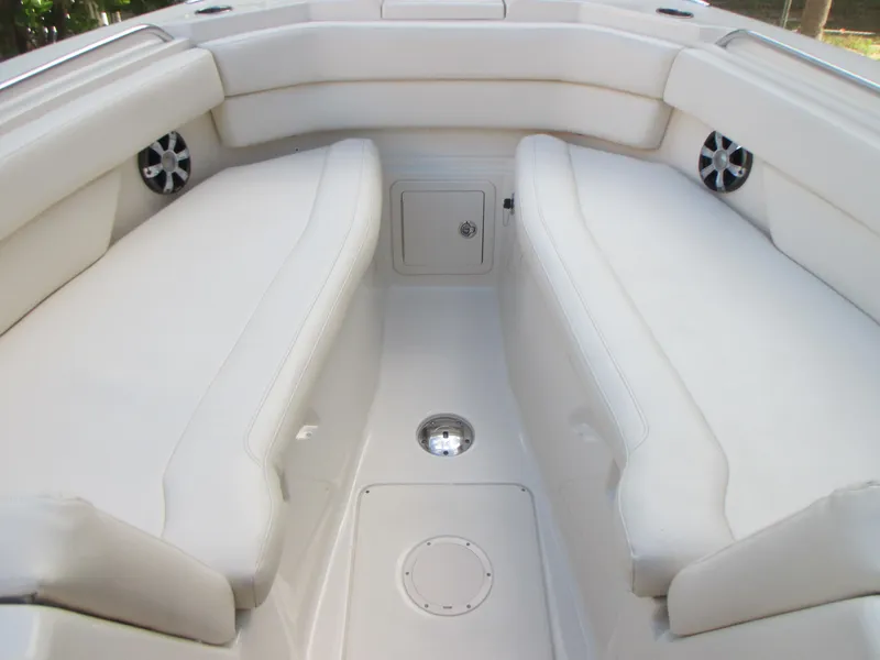 Slide: The Image of 2018 Grady-White Freedom 307 boat interior with white cushioned seating. - 35