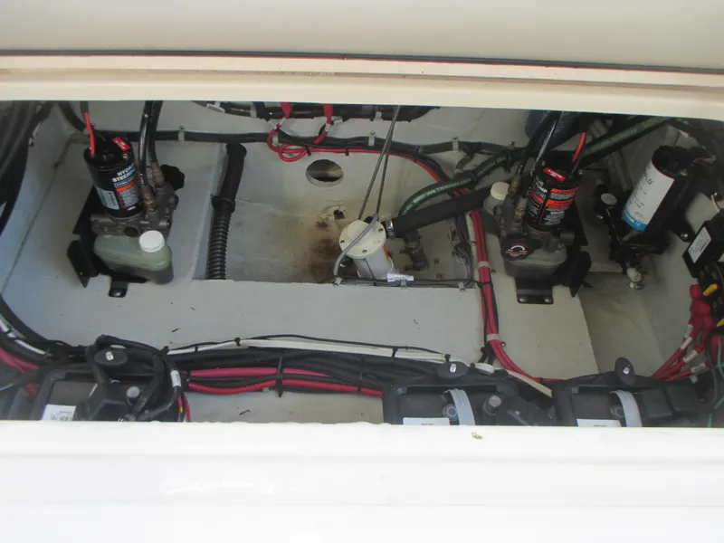 Slide: The Image of Engine compartment of 2018 Grady-White Freedom 307 boat, showing wiring and components. - 36