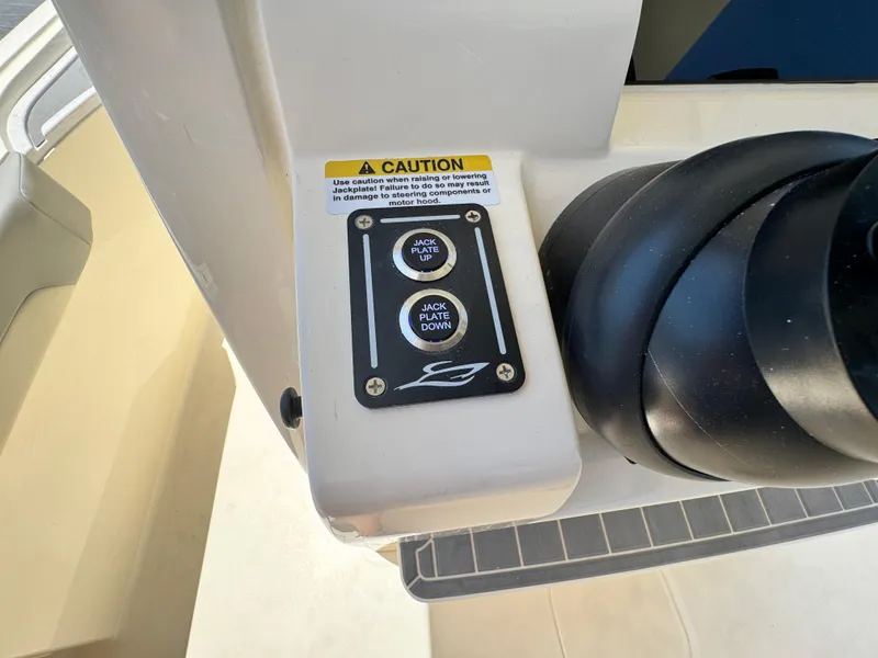 Slide: The Image of Control panel on a 2025 Scout 281 XSS boat with caution label. - 24