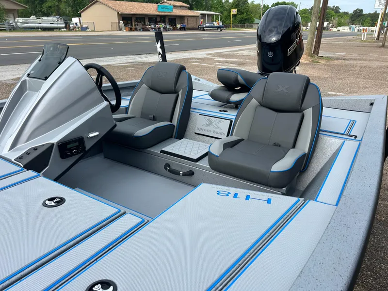 Slide: The Image of 2025 Xpress H18 boat interior with sleek gray seating and modern dashboard. - 3