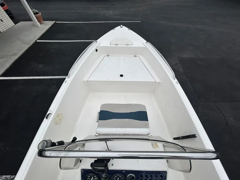 Slide: The Image of 2001 Sea Fox 172 CC 90 HP boat, interior view, parked on asphalt. - 11