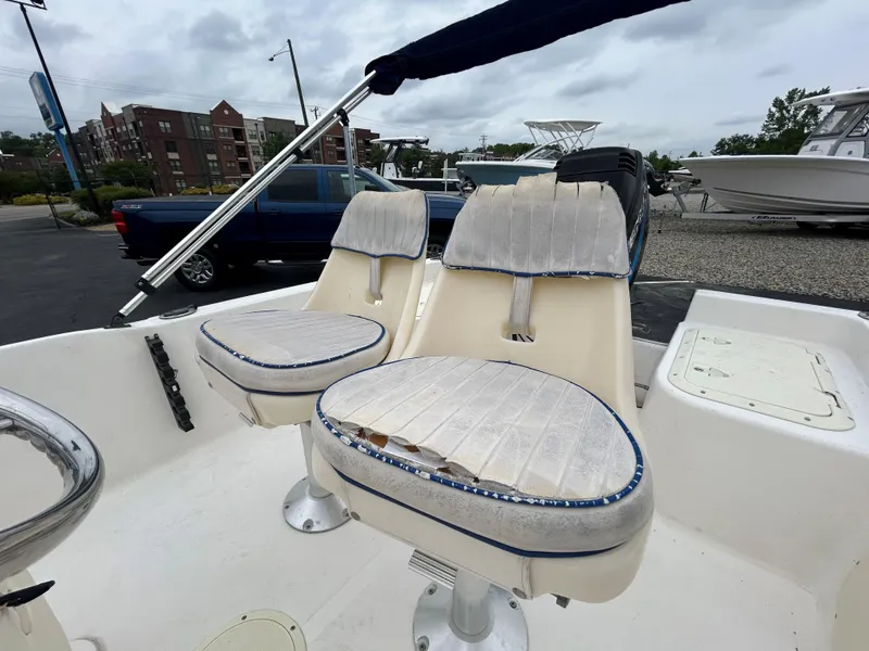 Slide: The Image of 2001 Sea Fox 172 CC boat interior with dual seats and steering console. - 13