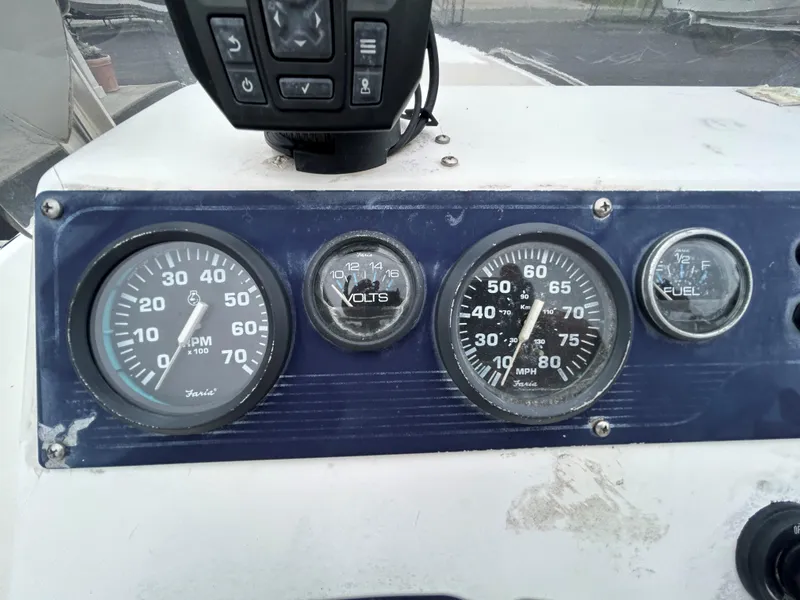Slide: The Image of Dashboard of a 2001 Sea Fox 172 CC boat with gauges and controls. - 15