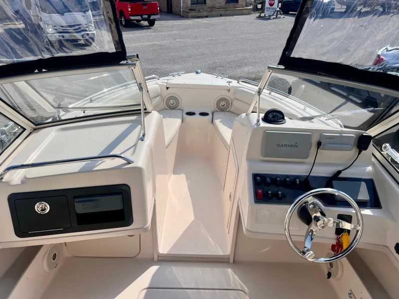 Slide: The Image of 2017 Grady-White Freedom 192 boat interior with steering wheel and control panel. - 11