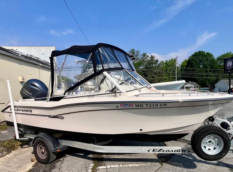 Slide: The Image of 2017 Grady-White Freedom 192 boat on trailer, parked outdoors. - 3
