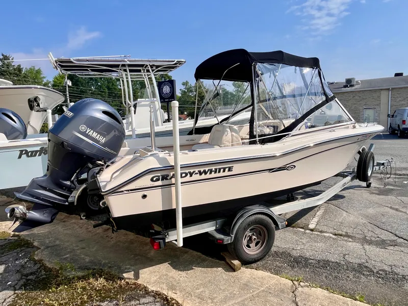 Slide: The Image of 2017 Grady-White Freedom 192 boat with Yamaha engine on trailer, parked outdoors. - 4