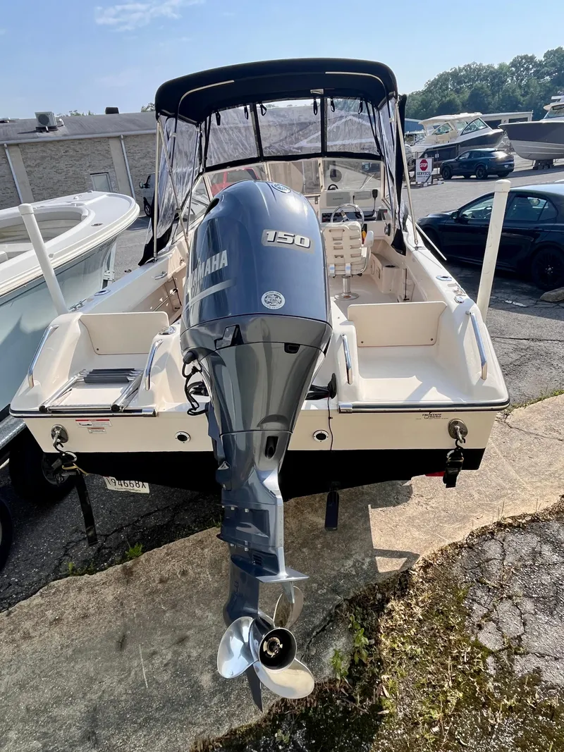 Slide: The Image of 2017 Grady-White Freedom 192 boat with Yamaha 150 outboard motor, docked outdoors. - 5