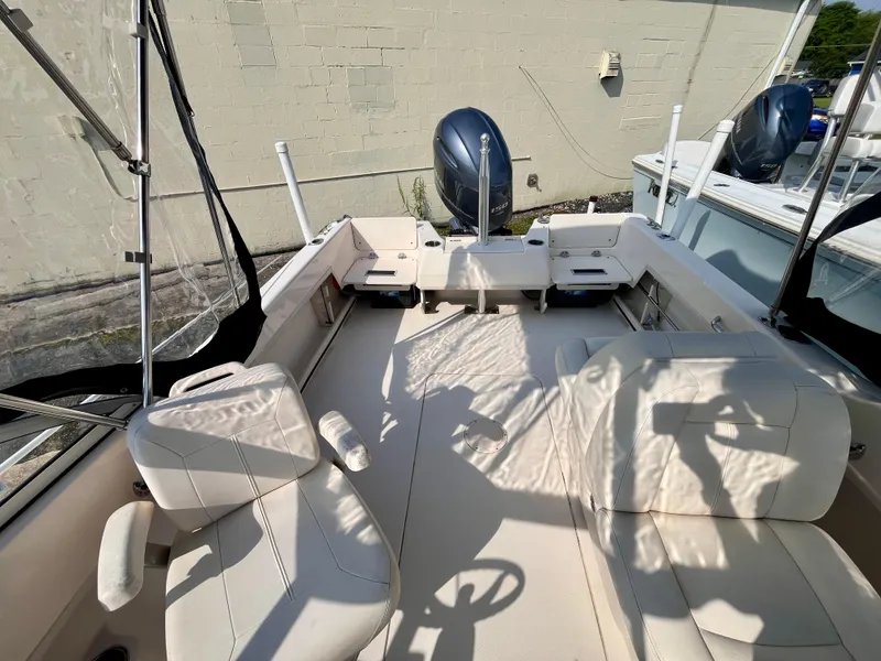 Slide: The Image of 2017 Grady-White Freedom 192 boat interior with seating and outboard motor. - 7