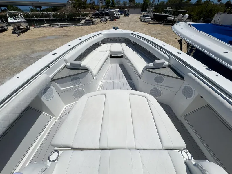 Slide: The Image of 2019 HCB 53 Sueños boat interior with white seating and spacious deck. - 21
