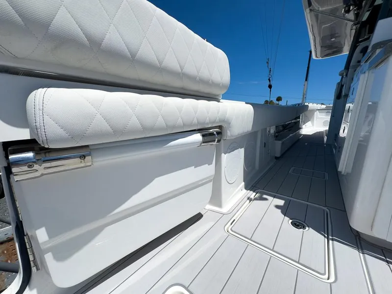Slide: The Image of 2019 HCB 53 Sueños boat interior with white seating and sleek design. - 30