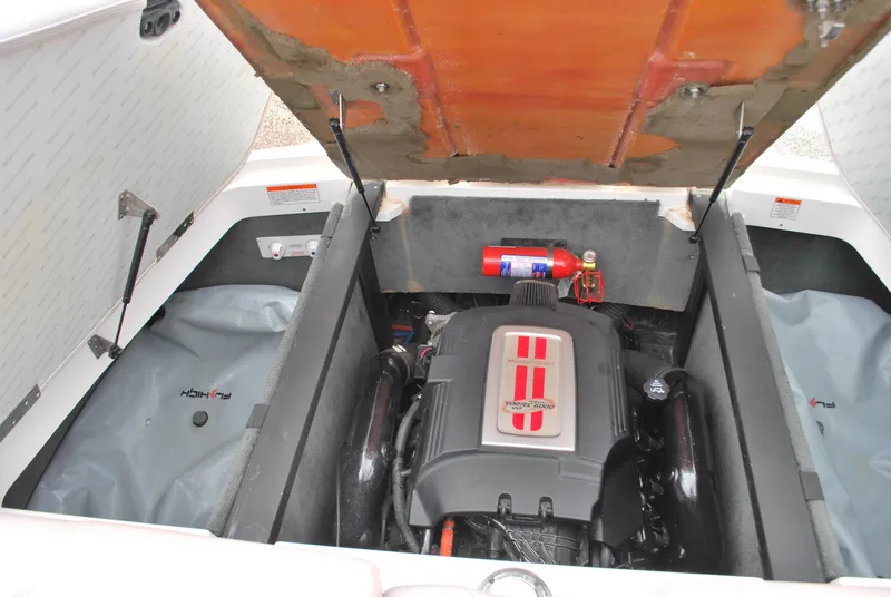 Slide: The Image of 2007 MasterCraft X45 engine compartment with open hatch and visible fire extinguisher. - 15