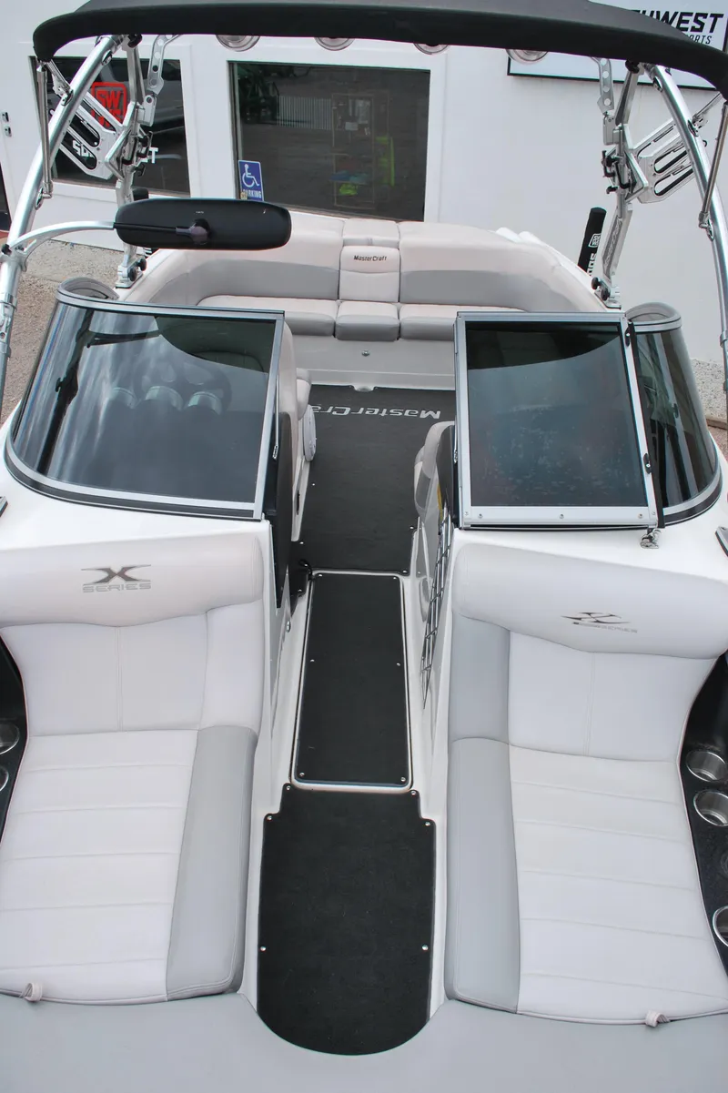 Slide: The Image of 2007 MasterCraft X45 boat interior with white seating and open windshield. - 3
