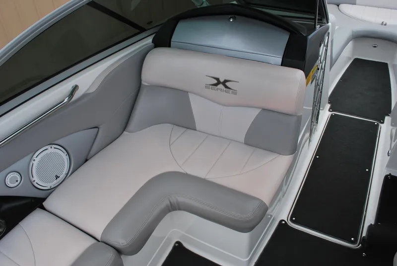 Slide: The Image of 2007 MasterCraft X45 boat interior with gray seating and speaker. - 6