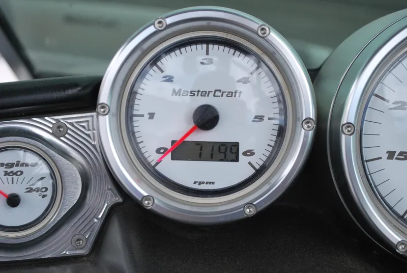 Slide: The Image of Close-up of 2007 MasterCraft X45 boat dashboard gauges displaying 719.9 hours. - 8