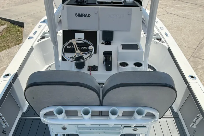 Slide: The Image of 2021 Sea Pro 248 Bay boat interior with steering console and seating. - 11
