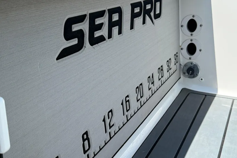 Slide: The Image of 2021 Sea Pro 248 Bay boat with measurement markings and logo detail. - 15