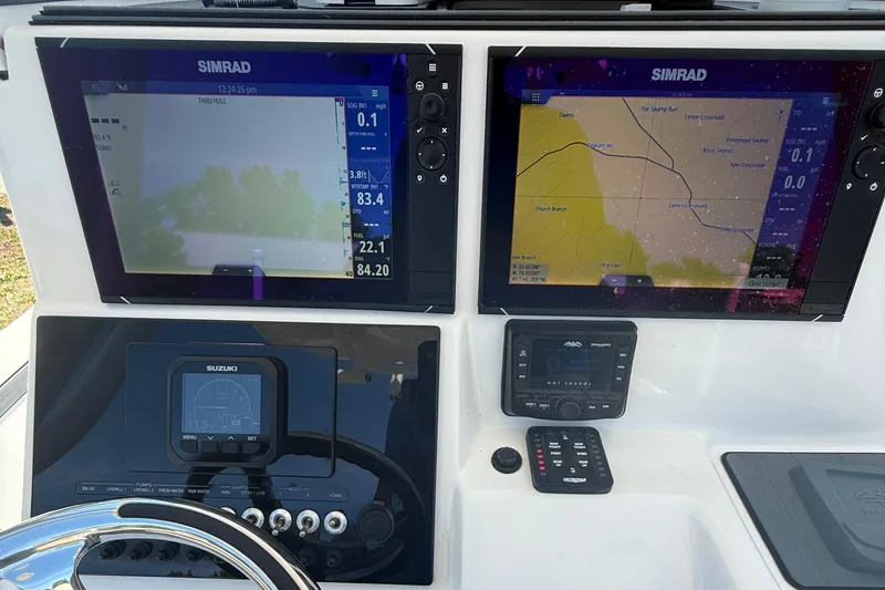 Slide: The Image of Dashboard of 2021 Sea Pro 248 Bay boat with Simrad navigation displays. - 17