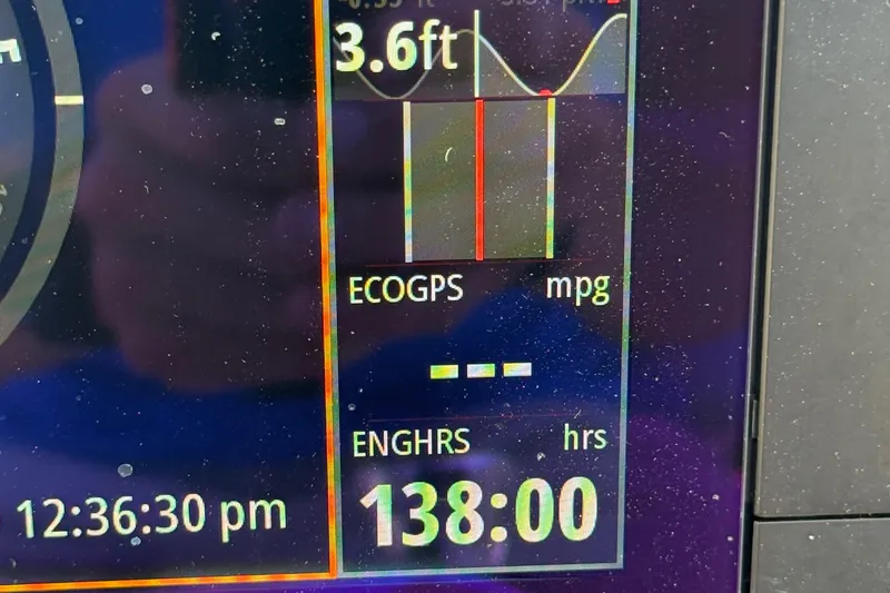 Slide: The Image of Display screen showing 3.6ft depth, 138 engine hours on 2021 Sea Pro 248 Bay. - 19