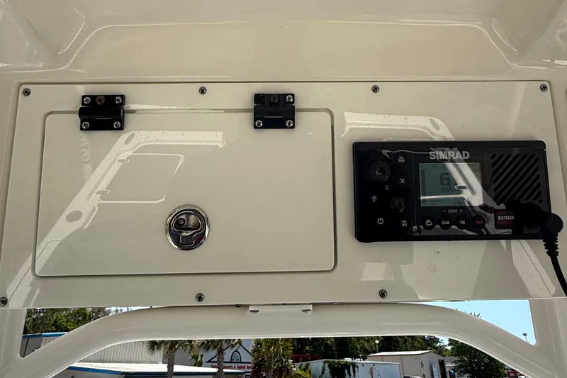 Slide: The Image of 2021 Sea Pro 248 Bay boat console with Simrad electronics and storage compartment. - 20