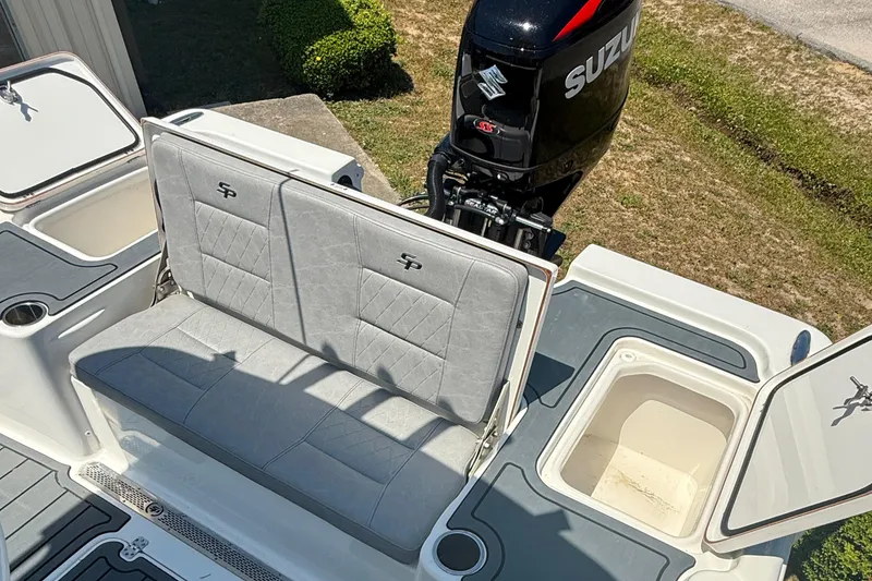 Slide: The Image of 2021 Sea Pro 248 Bay boat with Suzuki outboard motor and cushioned seating. - 8