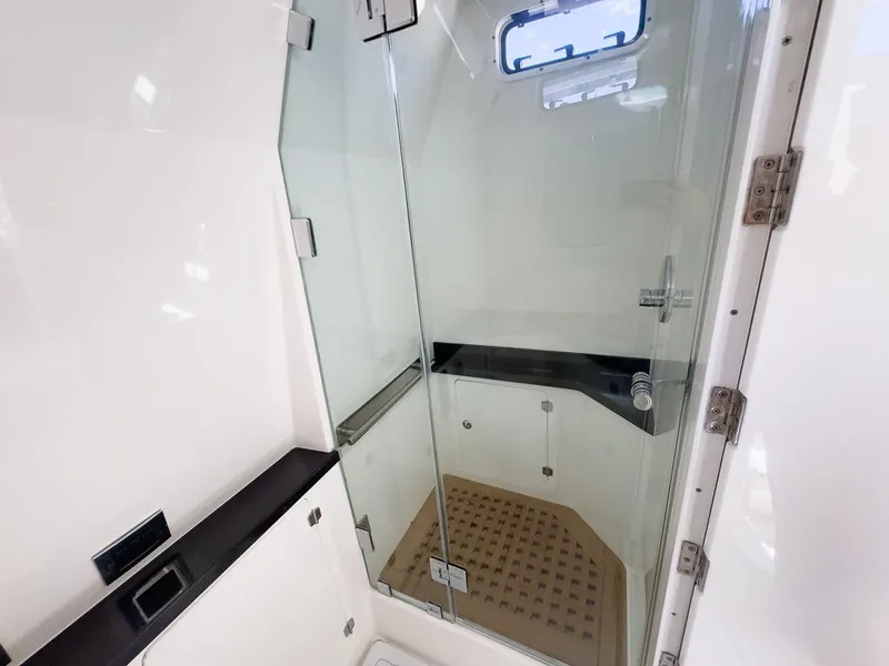 Slide: The Image of 2019 HCB 53 Sueños yacht bathroom with glass shower and modern fixtures. - 26