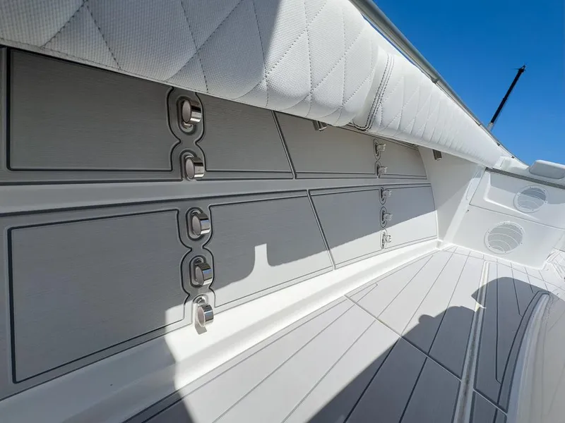 Slide: The Image of 2019 HCB 53 Sueños boat interior with sleek storage compartments and quilted upholstery. - 32