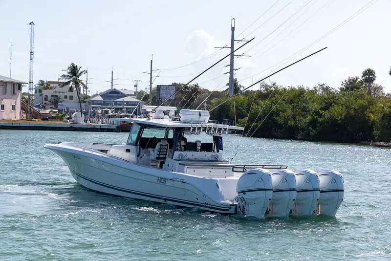 Slide: The Image of 2019 HCB 53 Sueños boat with four engines cruising on a sunny day. - 8