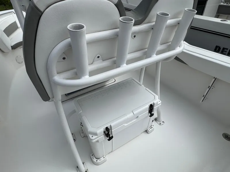 Slide: The Image of 2016 Tidewater 230 LXF boat with rod holders and cooler on deck. - 5