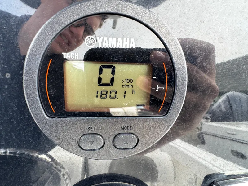 Slide: The Image of Yamaha tachometer displaying 180.1 hours on a 2016 Tidewater 230 LXF boat. - 7