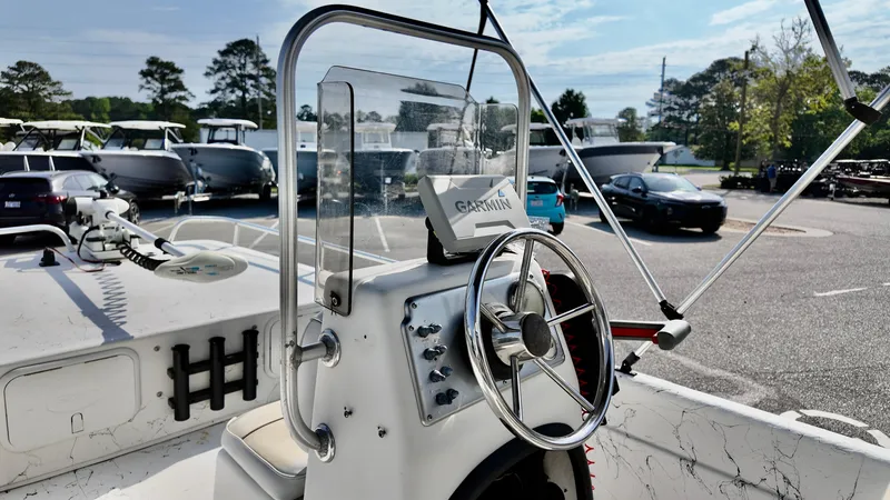Slide: The Image of 2008 Carolina Skiff 16 DLX boat with steering wheel and Garmin navigation system. - 8