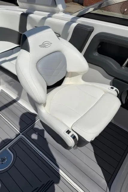 Slide: The Image of 2023 Chaparral 267 SSX boat seat, white leather, modern design. - 14