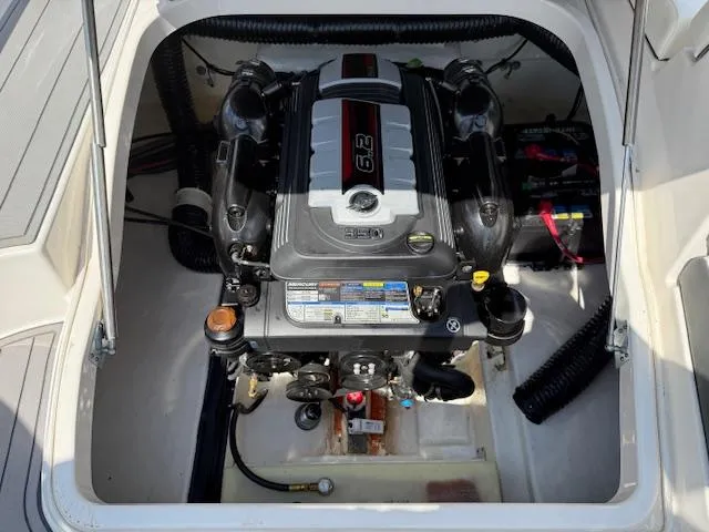 Slide: The Image of Engine compartment of 2023 Chaparral 267 SSX boat, showcasing powerful engine components. - 25