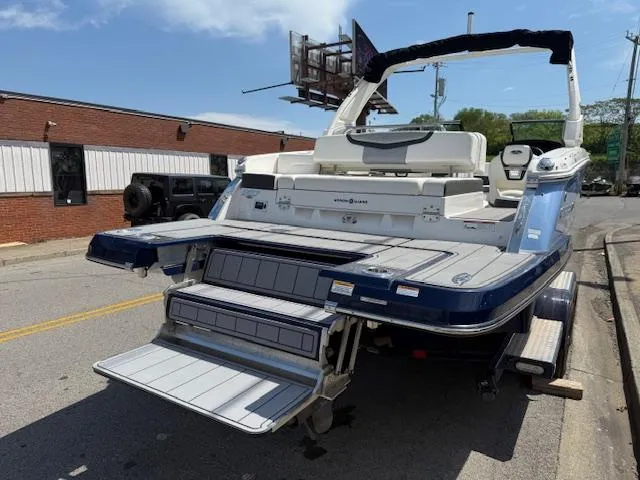 Slide: The Image of 2023 Chaparral 267 SSX boat with extended swim platform on a street. - 33