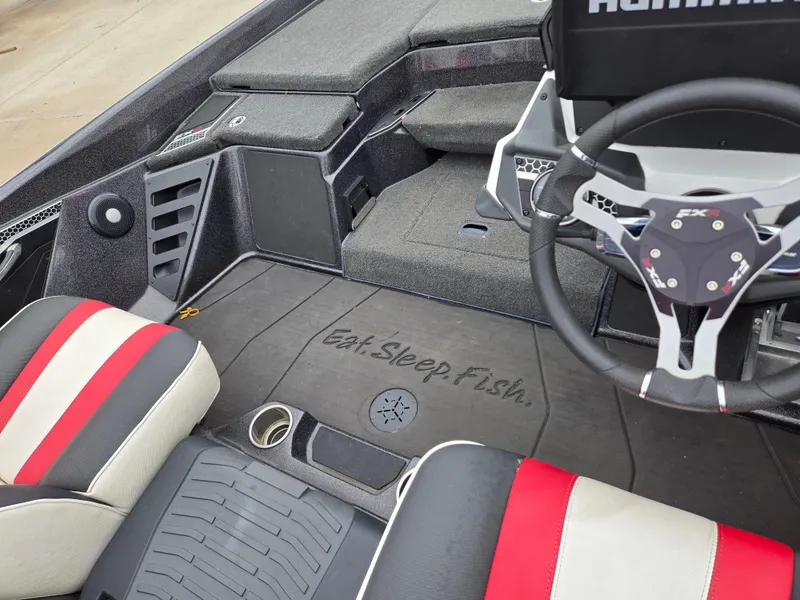 Slide: The Image of 2022 Skeeter FXR 20 Limited boat interior with "Eat. Sleep. Fish." text on floor mat. - 3