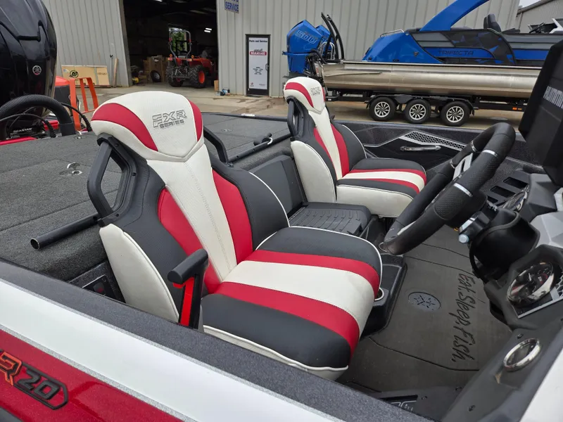 Slide: The Image of 2022 Skeeter FXR 20 Limited boat interior with red, white, and black seats. - 4