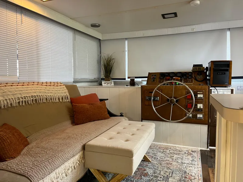 Slide: The Image of Cozy boat interior with a vintage helm, sofa, and decorative pillows, Gibson Standard 1988. - 13