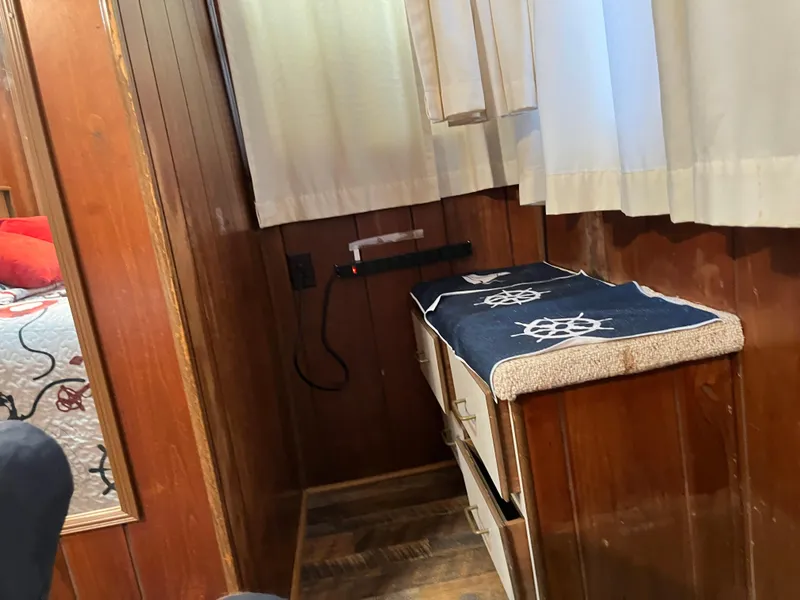 Slide: The Image of Cozy wooden interior with nautical-themed decor and curtains, featuring a Gibson Standard 1988 model. - 24