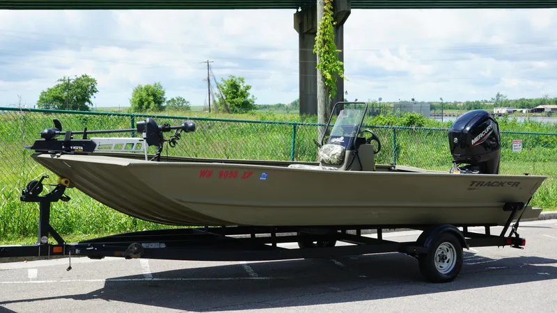 Slide: The Image of 2024 Tracker Grizzly 2072 SC All-Welded boat on trailer, parked outdoors. - 5