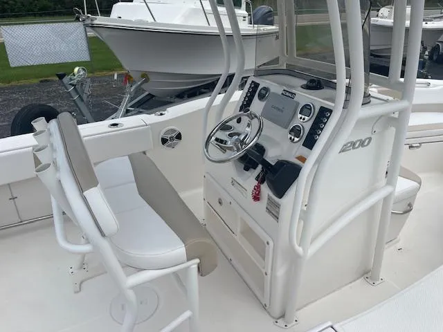 Slide: The Image of 2017 Robalo R200 Center Console boat interior with steering wheel and controls. - 4