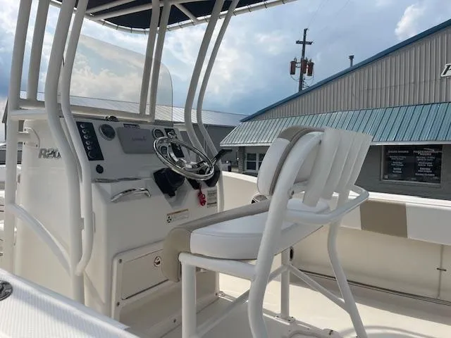 Slide: The Image of 2017 Robalo R200 Center Console boat interior with steering wheel and seating. - 5