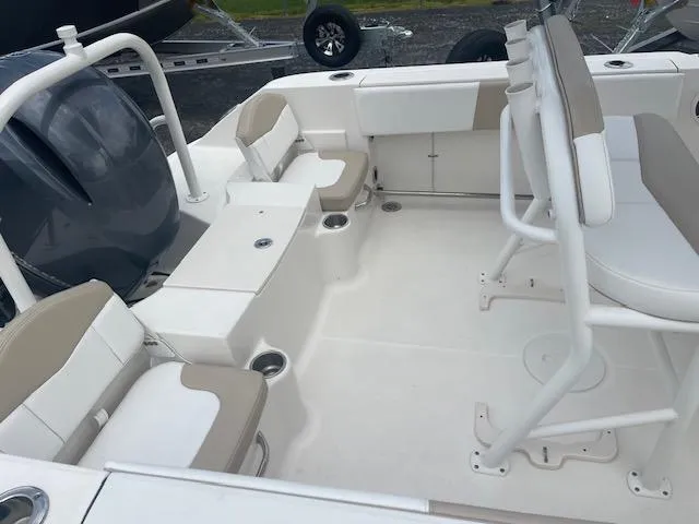 Slide: The Image of 2017 Robalo R200 Center Console boat interior with seating and storage. - 6