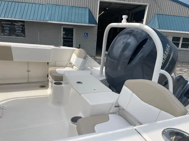 Slide: The Image of 2017 Robalo R200 Center Console boat interior with seating and Yamaha engine. - 7