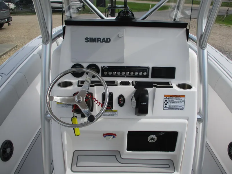Slide: The Image of 2022 Sea Fox 228 Commander boat console with steering wheel and Simrad electronics. - 11