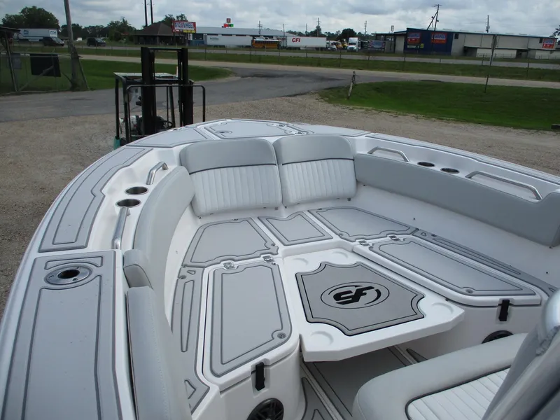 Slide: The Image of 2022 Sea Fox 228 Commander boat interior with cushioned seating and storage compartments. - 17