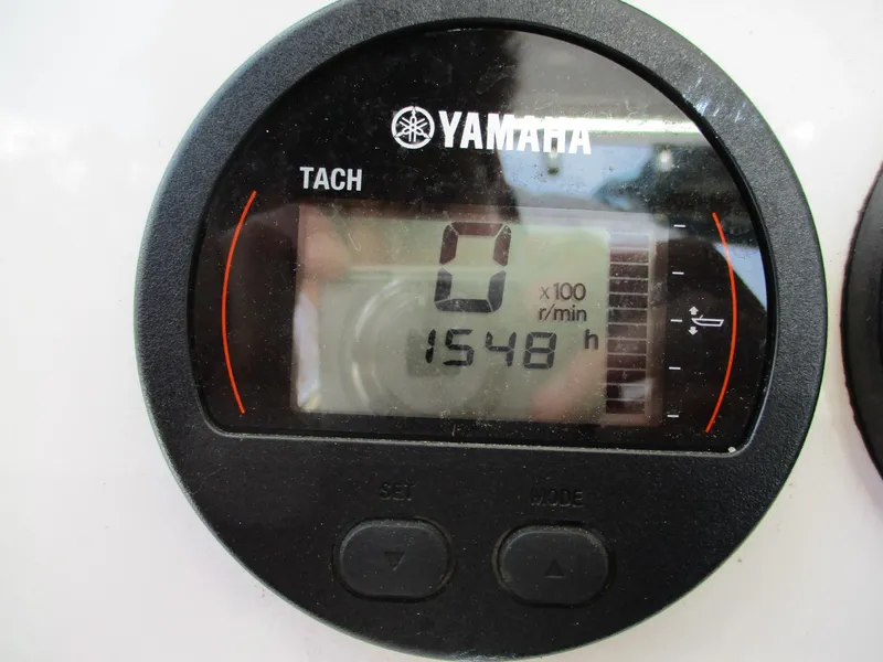 Slide: The Image of Yamaha tachometer displaying 1548 hours on a 2022 Sea Fox 228 Commander boat. - 20