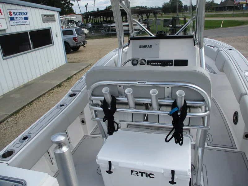 Slide: The Image of 2022 Sea Fox 228 Commander boat interior with fishing rod holders and RTIC cooler. - 8