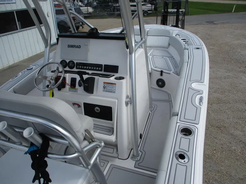Slide: The Image of 2022 Sea Fox 228 Commander boat interior with steering console and seating. - 9