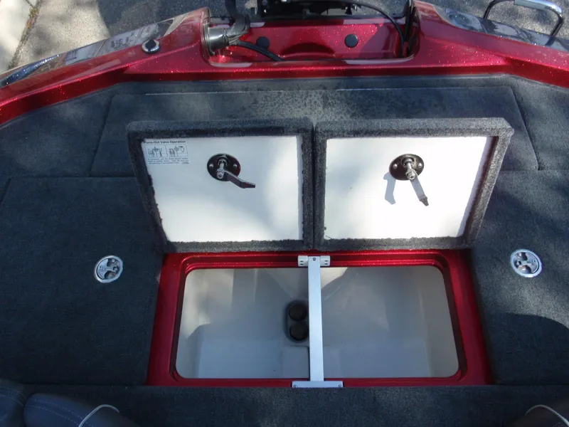 Slide: The Image of 2017 Ranger Z518 Comanche boat storage compartments with open lids, showcasing interior space. - 15